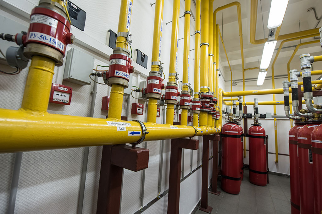 Giant Argon Fire Extinguishers in a rack